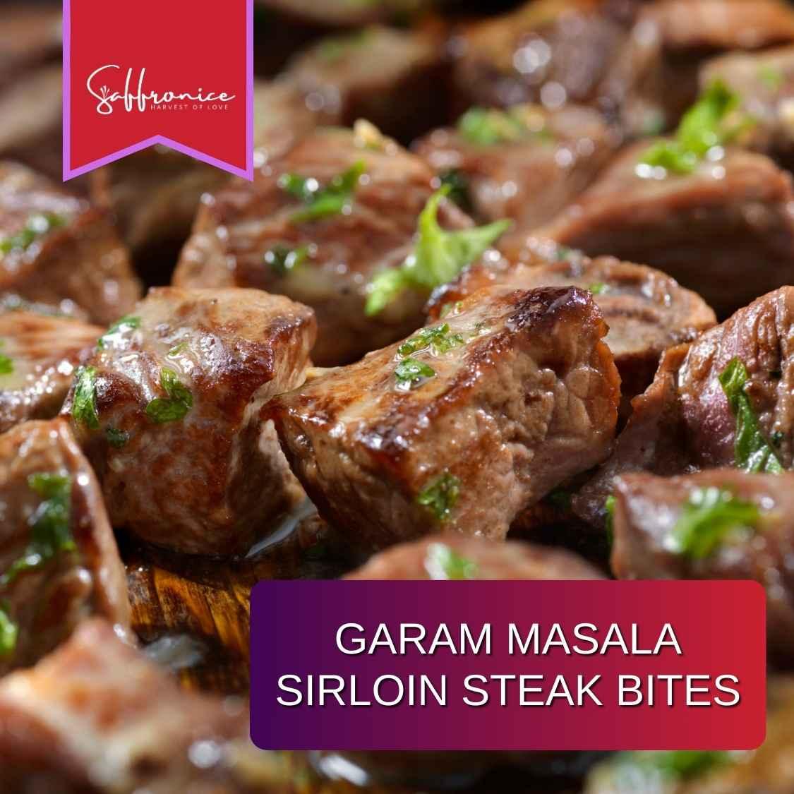 Close-up of garam masala sirloin steak bites garnished with herbs on wooden surface