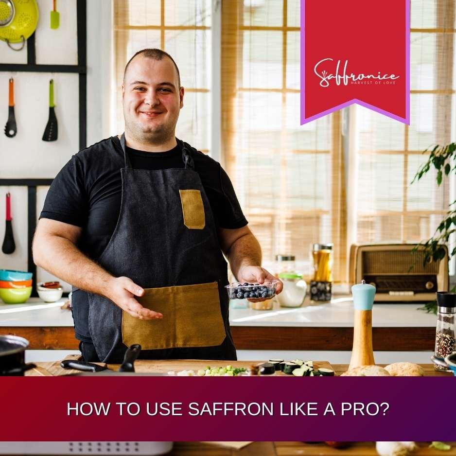 Smiling chef in black apron holding blueberries in a bright kitchen preparing food with fresh ingredients