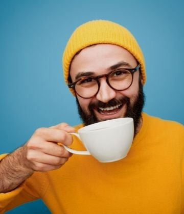 Man Drinking Date Seed Coffee
