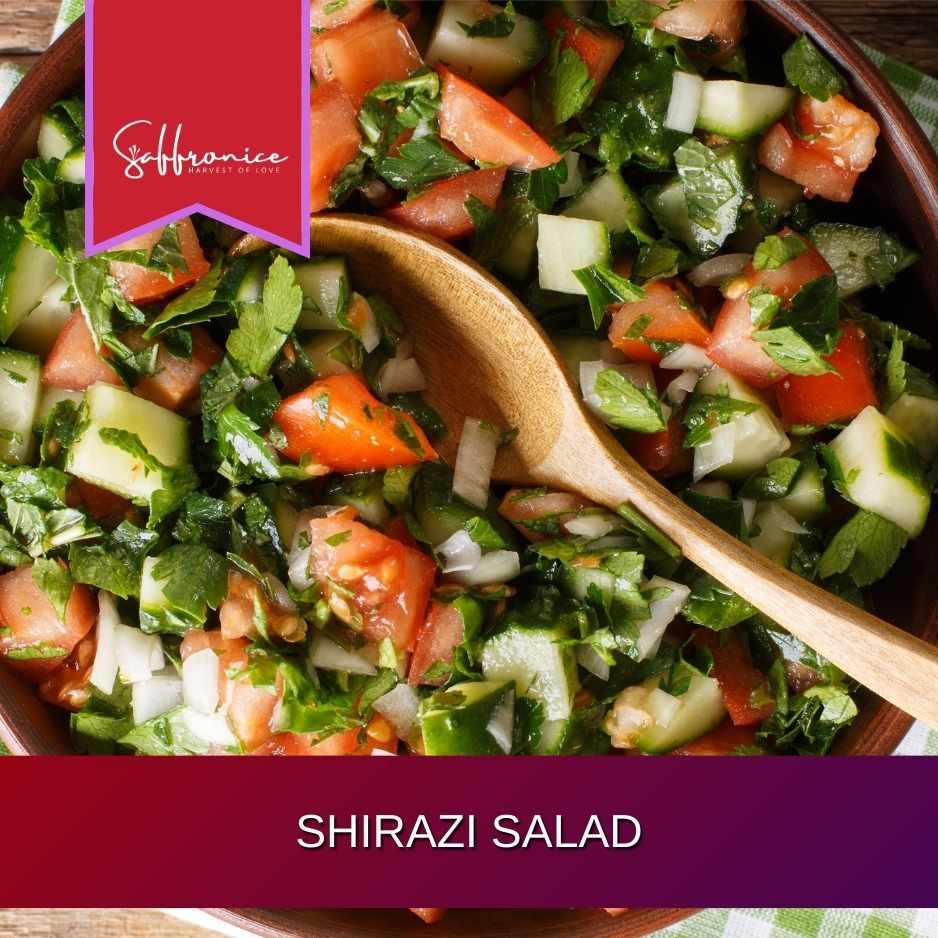 Fresh Shirazi salad with diced cucumber, tomato, onion, and parsley in a brown bowl with a wooden spoon