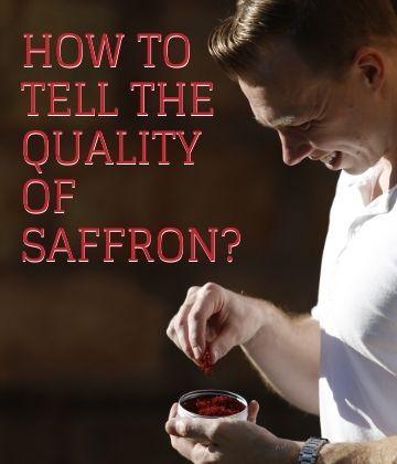 Man examining quality of red saffron threads in a glass bowl with text how to tell the quality of saffron