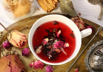 Cup of tea with dried rose buds